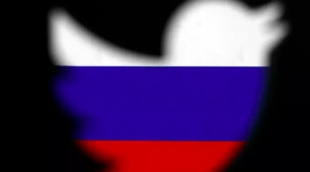 Twitter logo over Russian flag