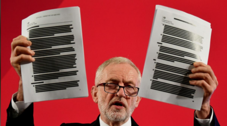 Jeremy Corbyn holding up leaked documents