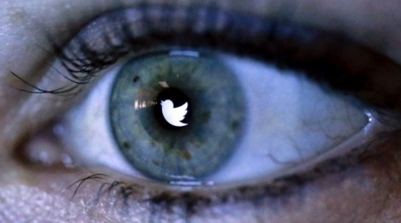 Twitter logo in iris of an eye